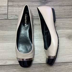 Calvin Klein tan and black leather flats